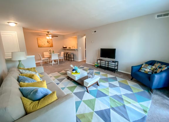 Spacious living room open to the dining room at Camelot East Apartments, Fairfield, 45014