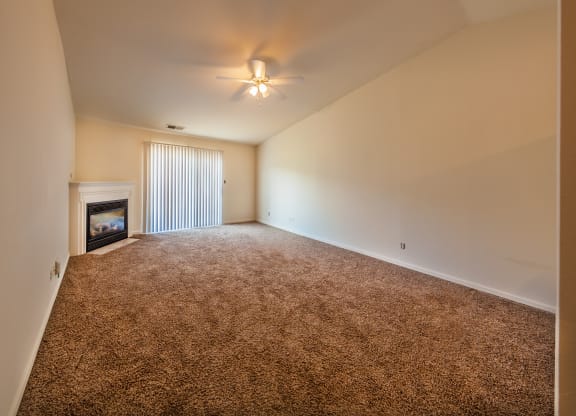 Spacious living room with gas fireplace at Barton Farms in Greenwood, IN 46143