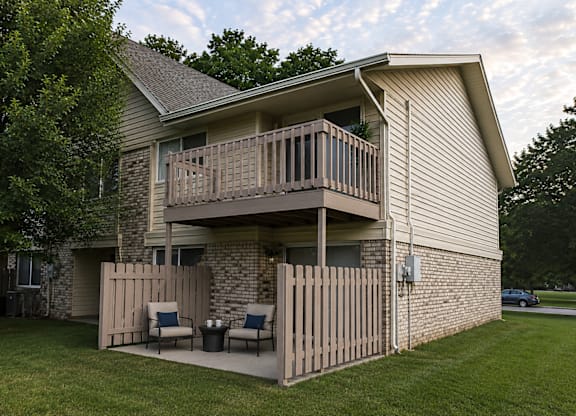 A house with a balcony and a fence.