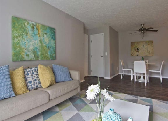 Modern spacious living room with wood style flooring  at Camelot East Apartments, Fairfield, OH