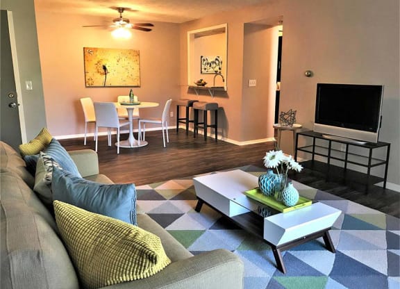 Large modern living room with adjacent dining room at Camelot East Apartments, Ohio, 45014