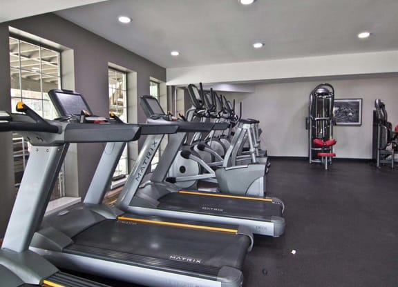 Spacious fitness center with modern workout equipment  at Camelot East Apartments, Fairfield, Ohio