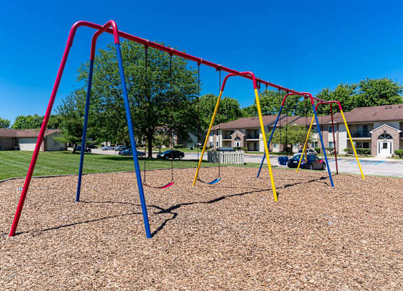 a swing set at a playground at Creekside Square Apartments, Indianapolis Indiana