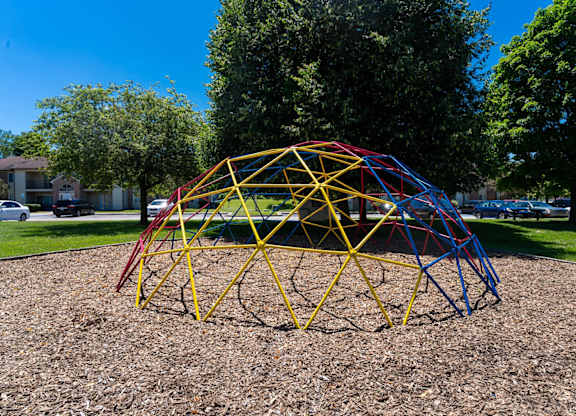 a pyramid of playground equipment in a park at Creekside Square Apartments, Indianapolis, IN