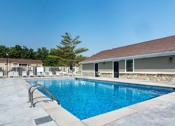 A swimming pool at The Village at Sandstone Apartments, Greenwood