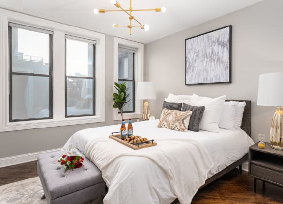a bedroom with a large bed and a window