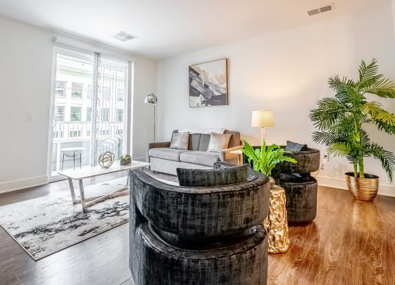 a living room with a couch and a round table
