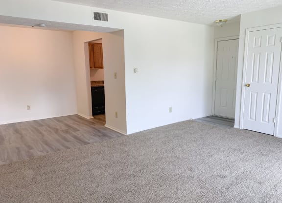 Large dining room open to the living room at Waterstone Place Apartments in Indianapolis, IN46229