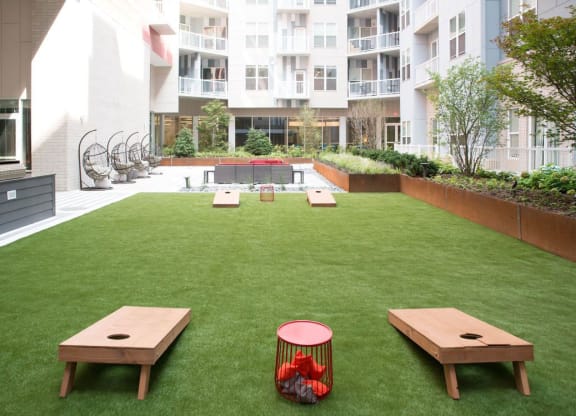 Outdoor Cornhole Game at The Whit Apartments, Indianapolis, 46204