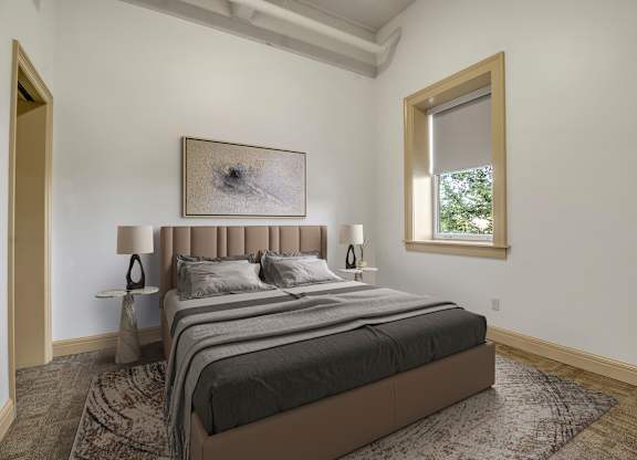 A bedroom with a large bed and a painting on the wall. at 100 South Apartments, New York, 14202