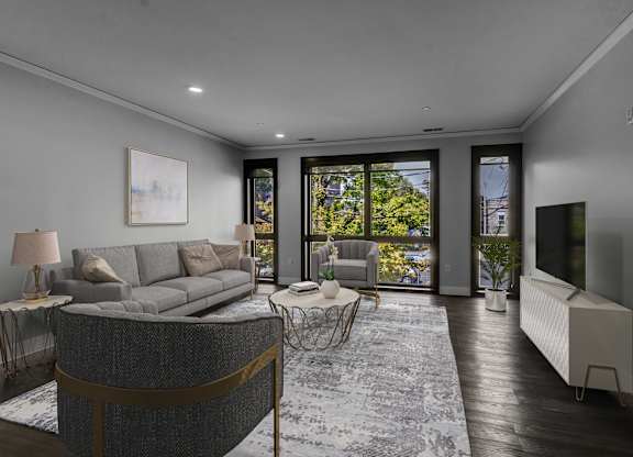 Living room with balcony access and hardwood flooring at Nineteen North Apartments, Buffalo, 14202