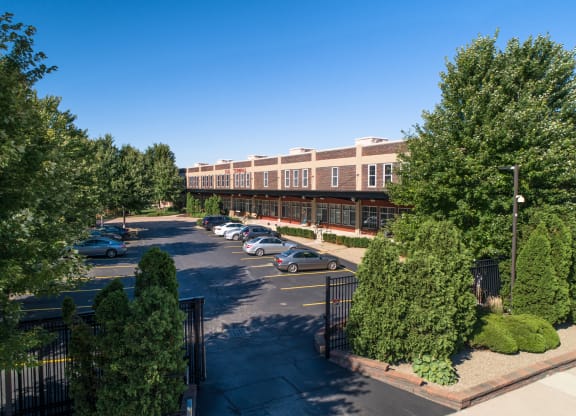 an aerial view of a building with cars parked in a parking lot at The Lofts at Elk Terminal, Buffalo, NY, New York, 14204