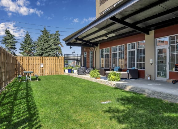 a backyard with a patio and a fence at The Lofts at Elk Terminal, Buffalo, NY, New York