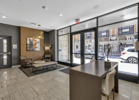 a lobby with a reception desk and a street view at Nineteen North, Buffalo, New York