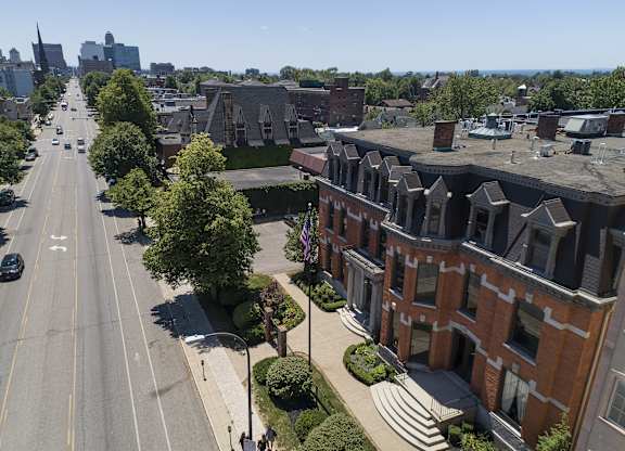an aerial view of a city street and houses at The Knights @ 506 Delaware Apartments, Buffalo, NY 14202