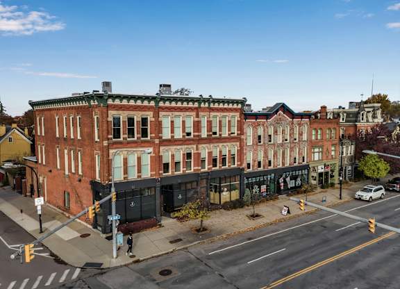 Historic brick buildings at urban street corner at The Granite Works Apartments, Buffalo, NY 14202
