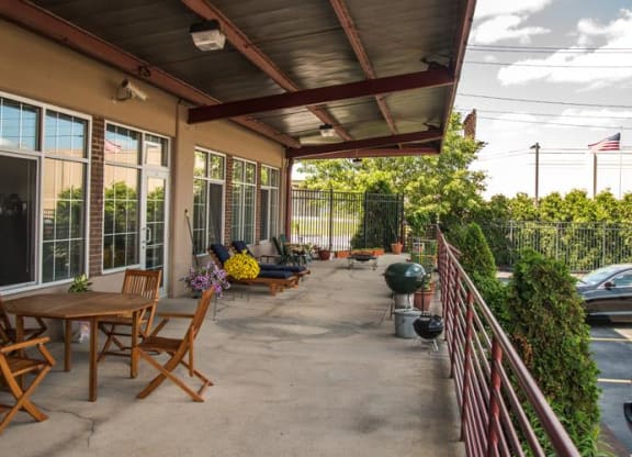 a patio with tables and chairs at The Lofts at Elk Terminal, Buffalo, 14204