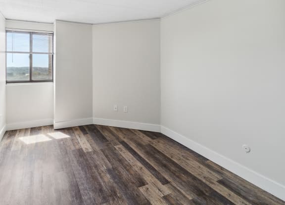 an empty room with wood floor at Walnut Towers at Frick Park, Pittsburgh, PA 15217