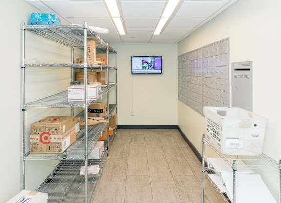 A storage room with shelves and boxes at Walnut Towers at Frick Park, Pittsburgh, Pennsylvania
