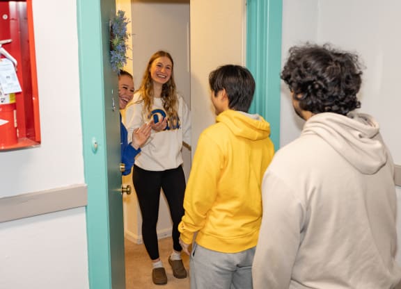 a group of people standing in front of a mirror at University Commons Apartments, Oakland, Pittsburgh