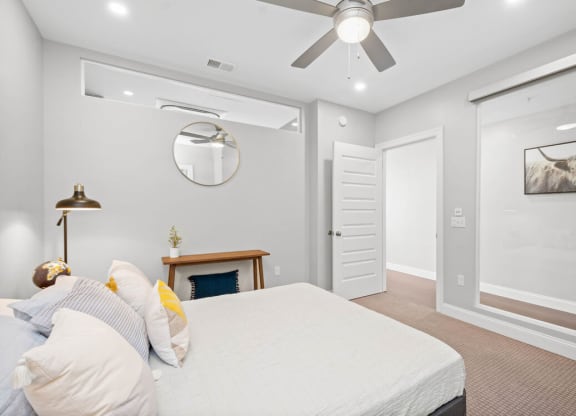 a bedroom with a bed and a ceiling fan at The Washington at Chatham, Pittsburgh Pennsylvania