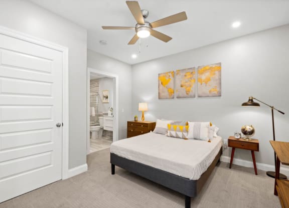 a bedroom with a large bed and a ceiling fan at The Washington at Chatham, Pittsburgh, 15219