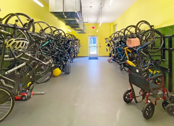 a room filled with lots of bikes and a stroller at Bakery Living in Pittsburgh, PA 15206