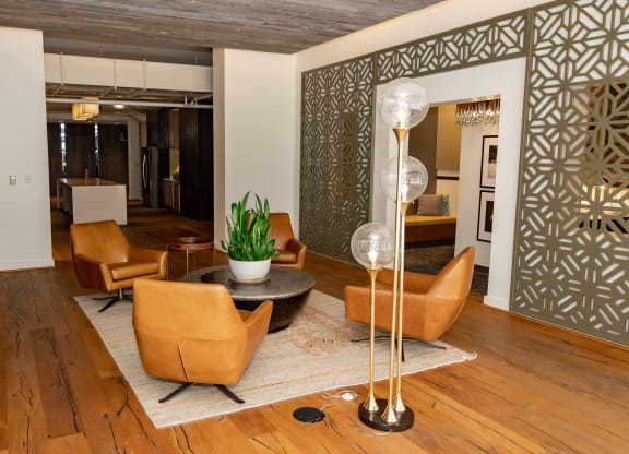 a living room filled with furniture and a large window at Bakery Living in Pittsburgh, PA 15206