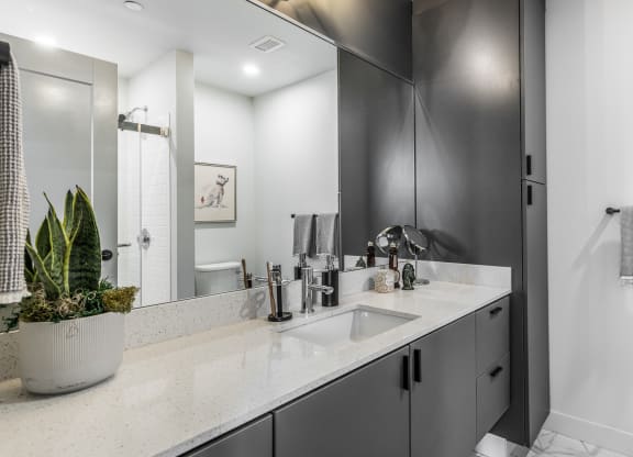a bathroom with a sink and a shower and a mirror at The Commonwealth Building, Pennsylvania