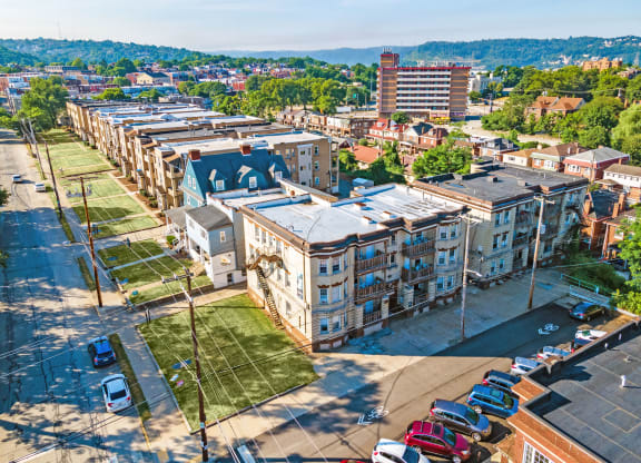 a view of the city from the top of a building at University Commons Apartments, Oakland, Pittsburgh