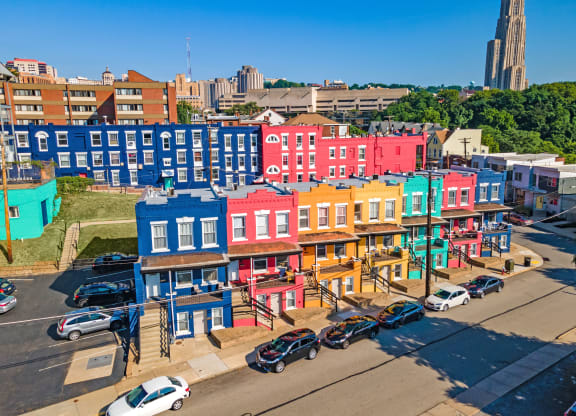 a cityscape of colorful buildings at University Commons Apartments, Oakland, Pittsburgh