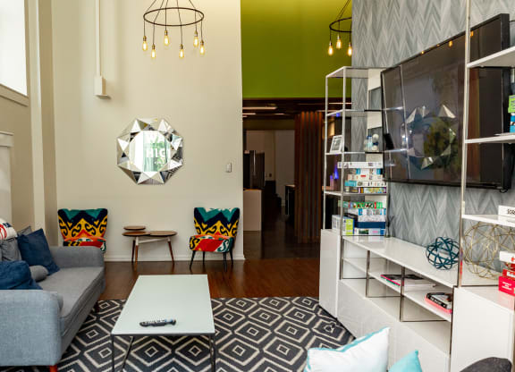 a living room with a gray couch and a white coffee table at Walnut on Highland, Pittsburgh, PA