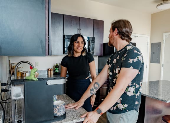 a man and a woman standing in a kitchen at Walnut on Highland, Pittsburgh, PA