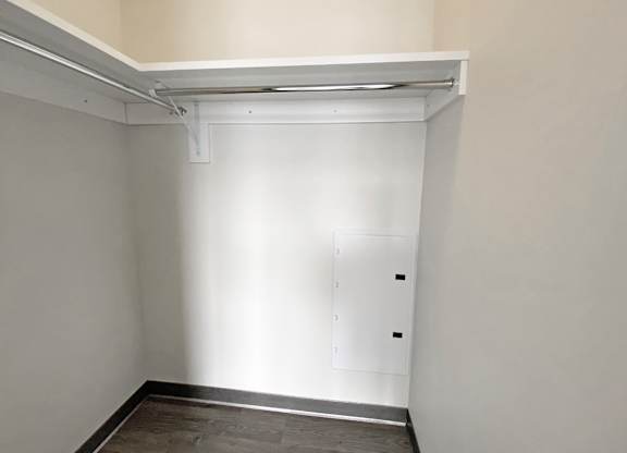 A white door with a white frame is in a white room.at Bakery Living, Shadyside, Pittsburgh, PA 15206