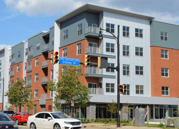 a large apartment building with a street sign in front of it Hot Metal Flats apartments, Southside Pittsburgh, PA