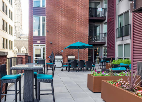 an outdoor patio with tables and chairs at Walnut on Highland, Pittsburgh, PA