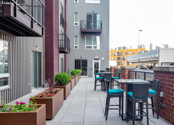 an outdoor patio with tables and chairs at Walnut on Highland, Pittsburgh, PA