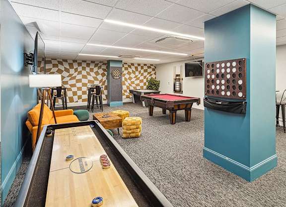 A room with a pool table and a foosball table. at The Washington at Chatham, Pennsylvania, 15219