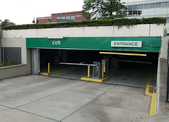 A parking garage with an entrance and exit. at The Washington at Chatham, Pennsylvania, 15219