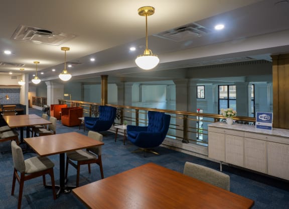 a dining room with tables and chairs and a bar at The Commonwealth Building, Pittsburgh, 15222
