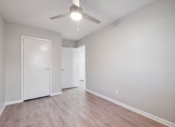 A Room With Wooden Flooring and Two Doors at Fair Oaks Apartments, Little Rock, 72204