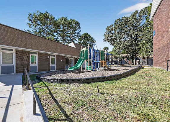 A Playground With a Green Slide at Fair Oaks Apartments, Little Rock, Arkansas