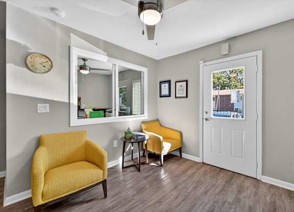 A Room With Two Yellow Chair at Fair Oaks Apartments, Little Rock, AR
