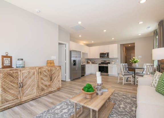 a living room with a couch and a table at Jackson Run Townhomes, Whitestown, IN