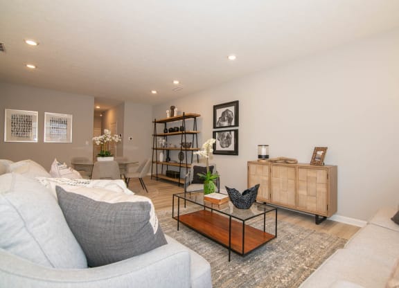 a living room with couches and a display of furniture at Jackson Run Townhomes, Indiana