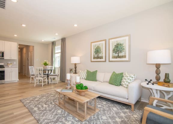 a living room with a couch and a table at Jackson Run Townhomes, Indiana