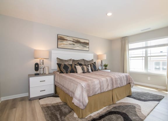 a bedroom with a bed and a window at Jackson Run Townhomes, Whitestown, 46075