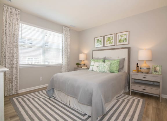 a bedroom with a bed and a window at Jackson Run Townhomes, Whitestown Indiana