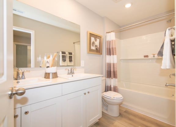 a bathroom with a sink and a toilet and a shower at Jackson Run Townhomes, Whitestown, IN 46075