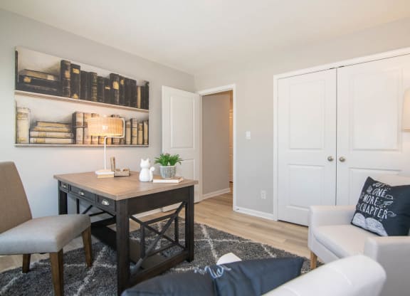a living room with a couch and a table at Jackson Run Townhomes, Indiana, 46075